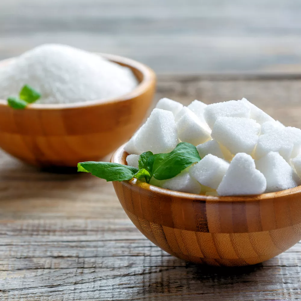 Bowls with sugar and sugar cubes.